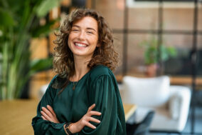 Beautiful woman smiling with crossed arms