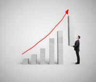 businessman-holding-big-graph